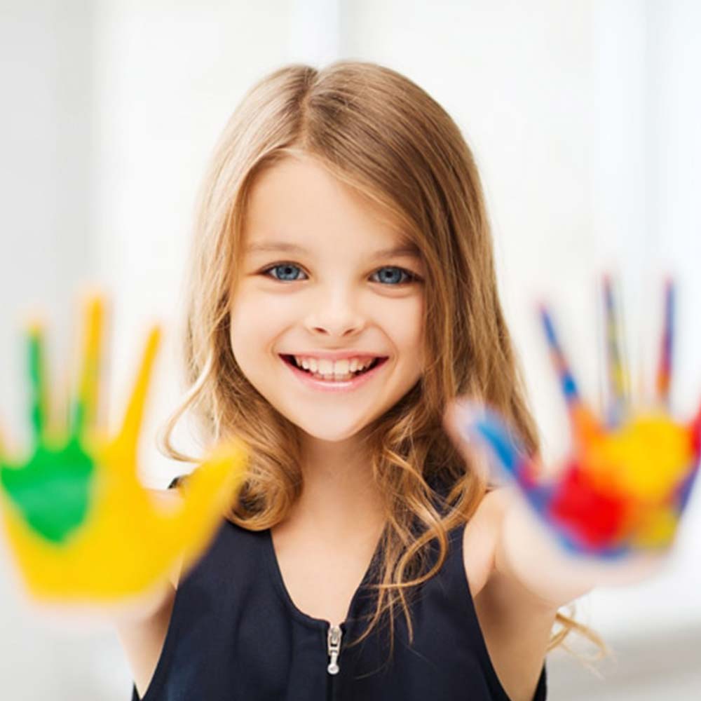 lumberton dental center lumberton tx services image Pediatric Routine Dental Care happy teen girl happy kid playing and having fun with a perfect smile on her face visiting Lumberton Dental Center
