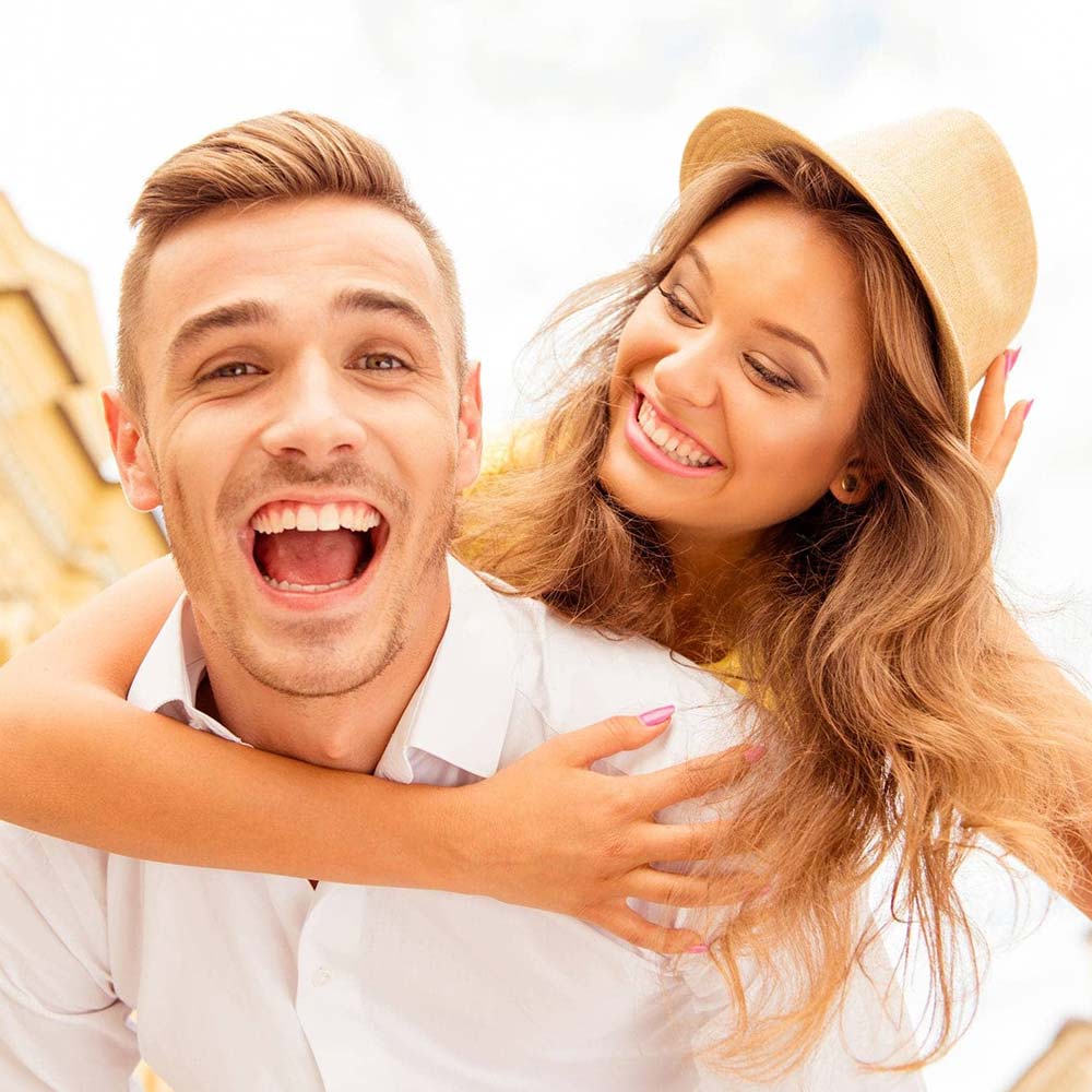 lumberton dental center lumberton tx services image Routine Dental Care happy smiling couple Portrait of a young couple with perfect smile after a visit at Lumberton Dental Center