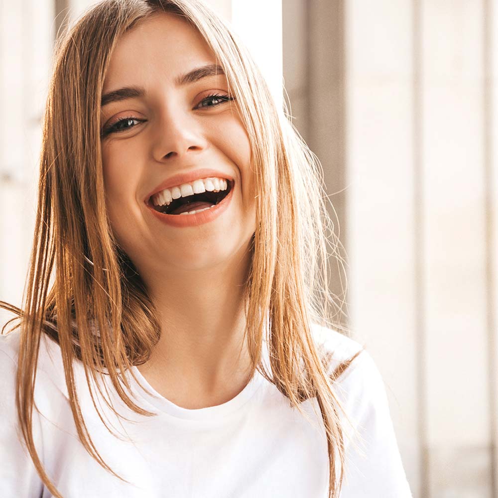 lumberton dental center lumberton tx services image Scaling and Root Planing happy young woman Portrait of beautiful young woman with perfect smile after a visit at Lumberton Dental Center