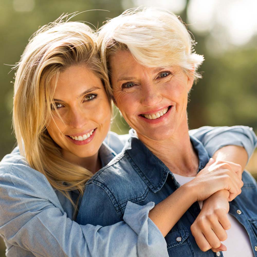 lumberton dental center lumberton tx services image Teeth Whitening happy mother and daughter Mother and Daughter smiling spending time together after a visit at Lumberton Dental Center